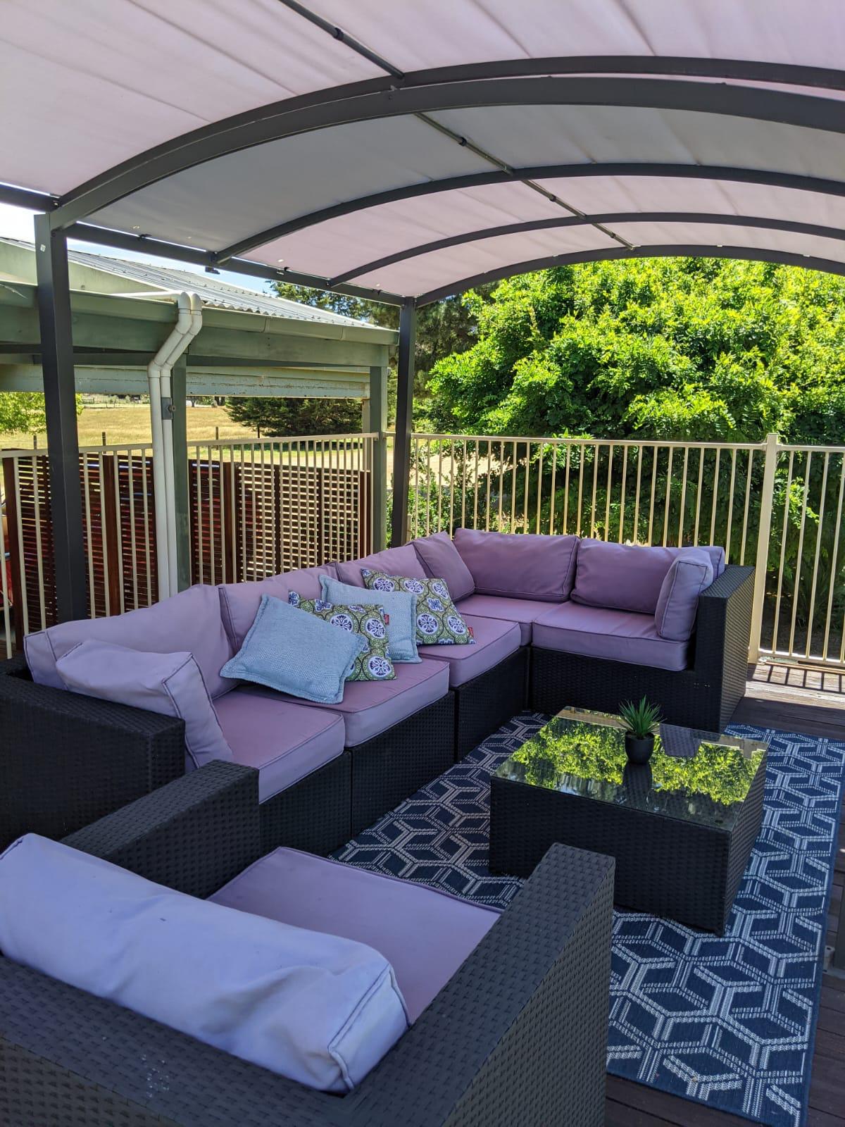 Outdoor lounge setting beside the pool